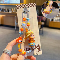 Accessoire de sac DIY : Petit pendentif en forme d'étoile, figurine de poupée, décoration de porte-clés, chaîne de téléphone portable perlée, style dessin animé tendance