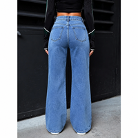 Jean évasé taille haute pour femme, bleu clair délavé, avec fente avant, coupe ample, en denim tendance, vente en gros directe usine OEM ODM