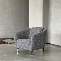 Fauteuil lounge moderne de luxe en tissu gris tissé, dossier incurvé, pieds en métal, fauteuil d'appoint pour la maison et l'hôtel