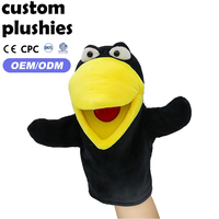 Marionnette à main en peluche noire douce en forme d'oiseau avec yeux de dessin animé, idéale pour les activités d'éveil - Prix direct usine