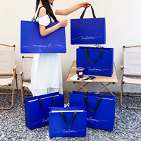 Sac en papier de luxe en carton ivoire, personnalisé, avec poignée en ruban découpée, sans pli central, réutilisable, avec estampage doré, pour promotion en supermarché