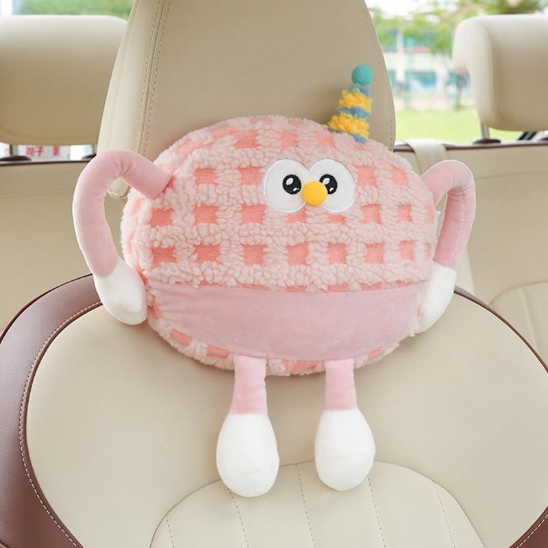 Appui-tête monstre en peluche à carreaux rose