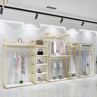 Portant à vêtements moderne en acier inoxydable doré, grande capacité, pour boutique, présentoir modulaire haut de gamme pour le commerce de détail