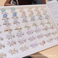 Cincin Zirkon Berlapis Emas Tembaga Mewah Ringan Trendi Baru Desain Mutiara Bunga dan Kupu-kupu Bergaya Lembut Serbaguna Ukuran Dapat Disesuaikan