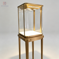 Vitrine moderne en verre et acier inoxydable avec éclairage LED et design rotatif pour magasin de détail