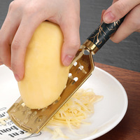 Multifunctionele keukenhulpjes van roestvrij staal, inclusief aardappel- en gemberrasp, fruit- en schilmes, rasp en ander keukengerei