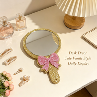 Miroir cosmétique portable à paillettes avec nœud rose et cadre doré, personnalisable avec logo, idéal pour cadeau promotionnel et ornement de bureau