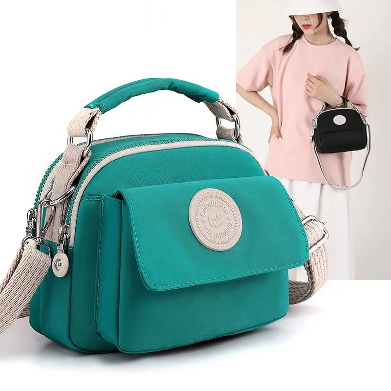 2024 nuevo bolso cruzado de tendencia de moda para mujer, bolso japonés Simple antisalpicaduras, bolso portátil con cambio de lápiz labial