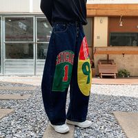Pantalon en jean style américain rétro, design color-block, imprimé patchwork, coupe ample et large, pour hommes et femmes, nouveau style