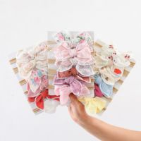 Accessoires pour cheveux en coton mousseline 100% avec des imprimés floraux en nylon de différentes couleurs et un nœud élastique pour les tout-petits