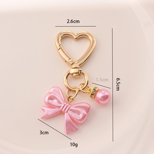 AM Fris en zoet strikje parel gouden deurknop sleutelhanger hanger schattig hoofdtelefoon etui tas hangend ornament - Product Image 4