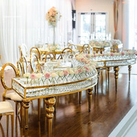 Table à manger brillante de banquet de mariage de forme du cristal S d'acier inoxydable avec le dessus en verre pour l'hôtel d'étoile