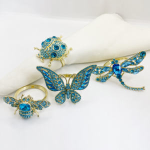 Ensemble de 4 anneaux de serviette de luxe en plaqué or avec cristaux bleus sur le thème du printemps pour la décoration de table - Product Image 1