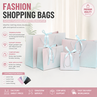 Sacs en papier de luxe imprimés sur mesure dégradé rose-bleu pour robes, emballage de vêtements de boutique, avec poignée élégante en ruban bleu clair et nœud