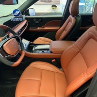 Sièges capitaine en cuir orange, surpiqûres diamant et perforations, inclinaison électrique, pour le SUV Lincoln Aviator