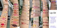 Private Label Clear Lipgloss Keychain Kit de vente en gros Vegan Squeeze Tube Gloss à lèvres rose brillant parfumé de luxe avec pompon
