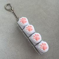 En gros, Porte-clés anti-stress en silicone Patte de chat, jouet à presser pour clavier mécanique, mignon et moelleux, breloque anti-stress pour usage quotidien