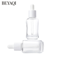 Flacon compte-gouttes en verre cylindrique transparent de 30 ml personnalisé en usine avec matériau recyclable pour les gouttes pour les yeux, les huiles essentielles, bouchon blanc
