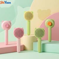 Brosse démêlante SHIYUAN en acier inoxydable pour chats et chiens, peigne à picots souples, outil de toilettage pour animaux, auto-nettoyant, pour une élimination facile des poils.