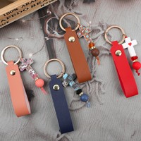 Porte-clés minimaliste, porte-clés en cuir croisé tendance, porte-clés en cuir PU pour femmes
