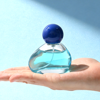 Flacon de parfum rond de 50 ml avec bouchon à bille, flacon pulvérisateur en verre avec logo personnalisé et boîte cadeau