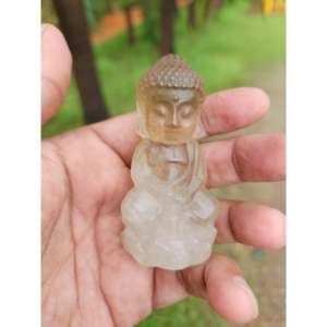 Escultura de Buda Bebé en Cuarzo Ahumado, un Poderoso Símbolo de Conexión a la Tierra, Equilibrio Emocional y Espiritual - Product Image 1