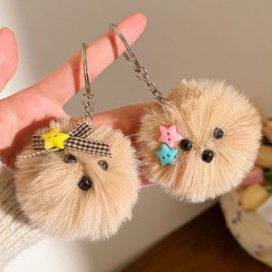 Al por mayor: Llavero y colgante para mochila de perro de peluche con lazo, bola de pompón esponjosa y gafas, diseño de cachorro adorable - Product Image 4