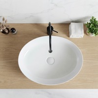 Vasque ovale en céramique de style minimaliste, à poser sur comptoir, pour salle de bain d'hôtel