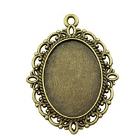 Pendentif ovale orné en filigrane ajouré, en alliage de zinc bronze antique, avec sertissage pour cabochon, pour bijoux camée victoriens