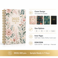Planificateur de santé personnalisé avec impression florale, couverture rigide, planificateur d'entraînement et de repas avec reliure spirale dorée et pages en couleur.