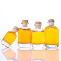 Venta caliente 50ml 100ml 150ml Contenedor de bebidas de jugo de licor Botella de vino de vidrio pequeña vacía