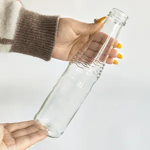 Vente en gros de bouteilles en verre transparent OEM 426ml écologiques Bouteilles de lait vides de qualité alimentaire pour boisson aux fruits