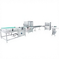 Machine de remplissage et de bouchage automatique pneumatique pour aérosols, pour applications cosmétiques et chimiques