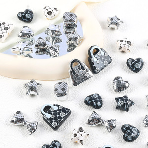 Luxe élégant doux noir blanc camélia étoile <span class=keywords><strong>amour</strong></span> arc sac à main breloques brillantes bricolage porte-clés sac suspendu bijoux coque de téléphone indésirable - Product Image 1