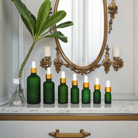 Flacon d'huile essentielle en verre mat vert vide de luxe Fuyun, flacon cosmétique européen givré, flacon compte-gouttes rond en verre doré métallique