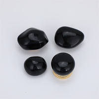 Forma única Tapa de perfume negra Forma de piedra Tapa de botella de perfume ABS de lujo
