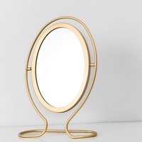 Vente en gros, cadre en métal moderne, vanité de Table, miroir cosmétique de maquillage ovale noir