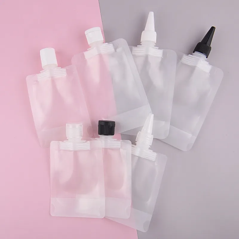 Factory price 50ml 100ml portable seal clamshell tip cover plastic liquid transparent self-standing suction mouth bag