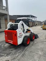 Chargeuse compacte sur pneus S18 d'occasion, en bon état d'origine, pour travaux de construction
