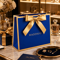 Sac cadeau de luxe bleu personnalisé avec logo, sac en papier écologique avec poignée en corde dorée pour boutique de bijoux et cosmétiques