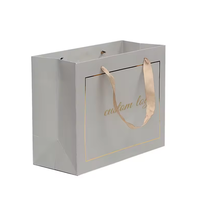 Vente en gros d'usine Sacs en papier cartonné sac à provisions en papier sac cadeau de luxe personnalisé avec poignées logo pour vêtements de travail