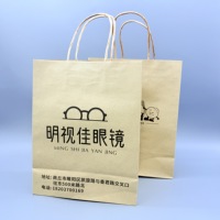 Sac en carton kraft écologique haut de gamme avec poignée en corde de coton et revêtement UV pour les magasins d'optique et l'emballage de cadeaux de lunettes