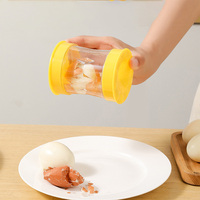 Nouveaux gadgets de cuisine séparateur de coquille d'oeuf rotatif accessoire décapant d'oeuf en plastique éplucheur fendu glisser hors de sa coquille
