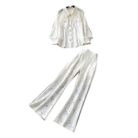 Ensemble chemise élégante en dentelle brodée à boutons et pantalon large pour femme, idéal pour les trajets quotidiens en automne