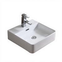 Lavabo de salle de bain moderne en céramique blanche polie avec meuble sous-évier et lavabo artistique intégré au comptoir