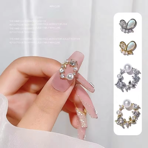 Paso Sico <span class=keywords><strong>2022</strong></span> Venta al por mayor de lujo: Diseño de dijes de circonita y aleación 3D con mariposas, lazos, perlas y flores para decoración de <span class=keywords><strong>uñas</strong></span> DIY - Product Image 1