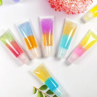 Gloss à lèvres en tube à marque privée avec effet arc-en-ciel bicolore vibrant et formule de gel brillant biologique, gloss à lèvres scintillant
