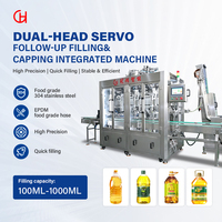 Machine de remplissage et de bouchage entièrement automatique à double tête avec suivi servo pour l'emballage de bouteilles d'huile de haute précision en usine de fabrication