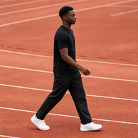 Pantalon de survêtement pour homme en polyester Ripstop avec logo personnalisé OEM, taille élastiquée, cordon de serrage intérieur et doublure en jersey interlock, idéal pour l'entraînement.