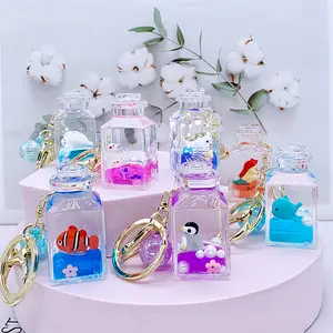 acrylic keyring key chain ring oil floating pink milk bubble boba drifting bottle fish pe quicksand cup liquid keychain